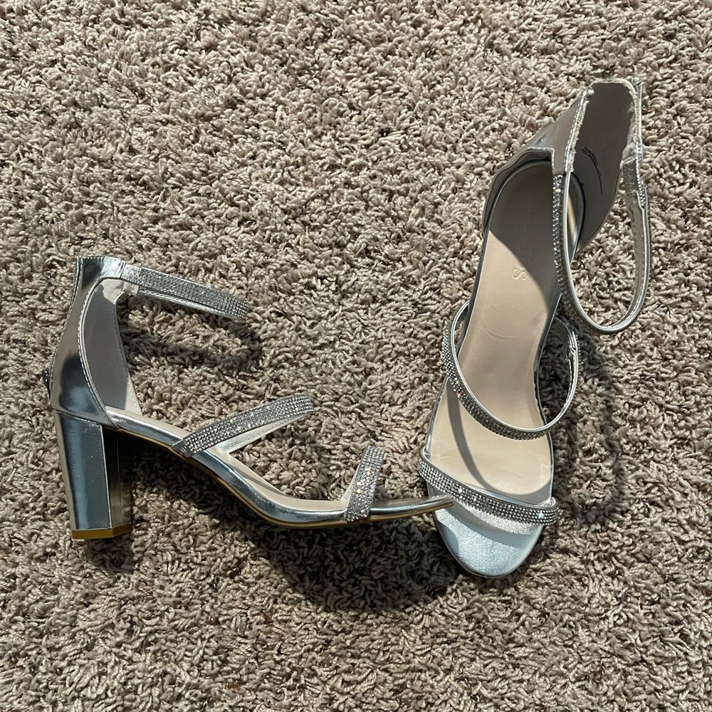 Silver high heeled shoes